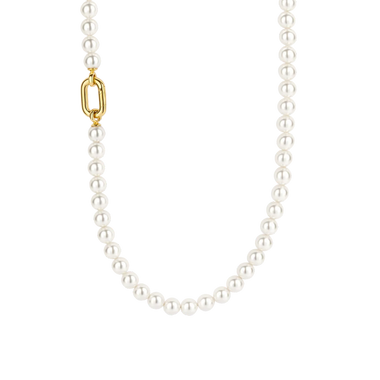 Colar de prata banhada a ouro com uma pérola de concha. A corrente é delicada e fina, destacando o pendente de pérola que adiciona um toque de elegância e sofisticação.