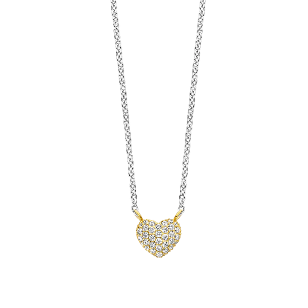 Colar de prata banhada a ouro com um pendente em forma de coração, totalmente cravejado com pequenas zircónias brilhantes. A corrente tem um design torcido, semelhante a uma corda, que complementa o pendente luxuoso e cintilante.”