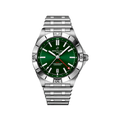 Relógio de pulso Breitling de aço inoxidável com mostrador verde, marcações brancas e prateadas, ponteiros luminosos e janela de data às 3 horas. O bisel tem números gravados e a pulseira é feita de elos de aço inoxidável combinando. O relógio possui certificação de cronômetro, conforme indicado pelo texto no mostrador.