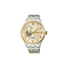 Relógio Seiko Presage Japanese Garden 41.8mm de pulseira prateada com duas linhas douradas, de caixa e mostrador dourados com indicação de dia da semana e mês