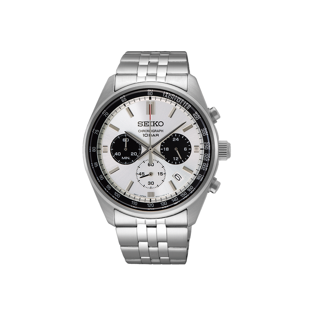 Um relógio de pulso de aço inoxidável com pulseira prateada e mostrador preto. O relógio tem uma caixa redonda com bordas texturizadas, lembrando uma engrenagem ou roda dentada, sugerindo que pode ter recursos adicionais como cronógrafo ou taquímetro. Os ponteiros ou números no mostrador não são visíveis devido a uma porção central obscurecida.