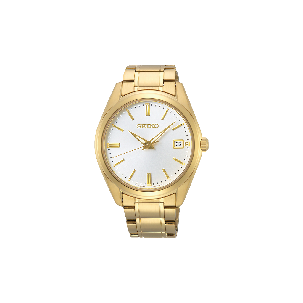 Um relógio de pulso Seiko de aço inoxidável com acabamento dourado. O relógio possui um mostrador branco, ponteiros e marcadores de hora dourados, e um visor de data na posição das 3 horas. A peça tem uma pulseira estilo bracelete e está centralizada contra um fundo simples.