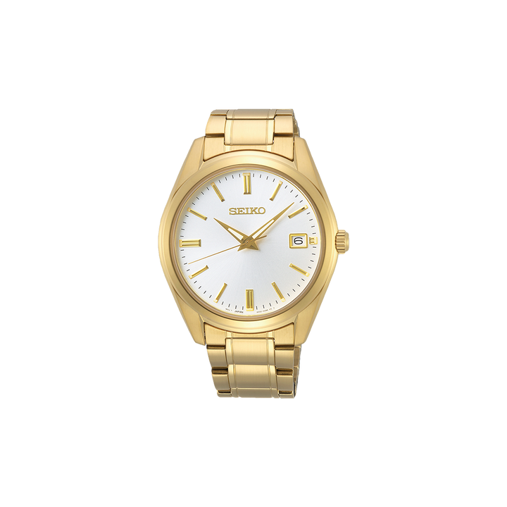 Um relógio de pulso Seiko de aço inoxidável com acabamento dourado. O relógio possui um mostrador branco, ponteiros e marcadores de hora dourados, e um visor de data na posição das 3 horas. A peça tem uma pulseira estilo bracelete e está centralizada contra um fundo simples.